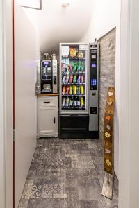 a refrigerator filled with lots of drinks in a kitchen at Pension Fünfhaus in Vienna