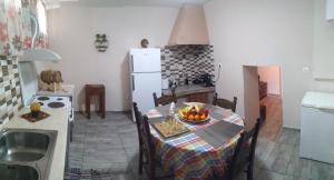 A kitchen or kitchenette at Chrisi Traditional House