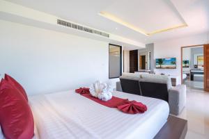 Postel nebo postele na pokoji v ubytování Paripas Patong Resort