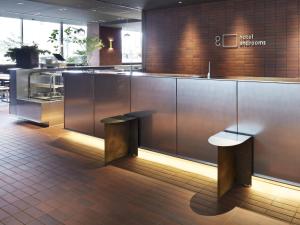 a kitchen with a counter and benches in a restaurant at hotel androoms Sapporo Susukino in Sapporo