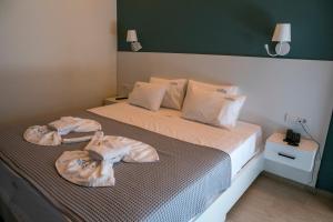 Postel nebo postele na pokoji v ubytování HOTEL ALEXANDER