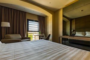 Postel nebo postele na pokoji v ubytování Salina Hotel
