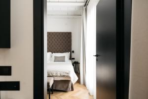 Posteľ alebo postele v izbe v ubytovaní Boutique Hotel Petit Montisión
