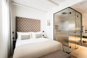 Posteľ alebo postele v izbe v ubytovaní Boutique Hotel Petit Montisión
