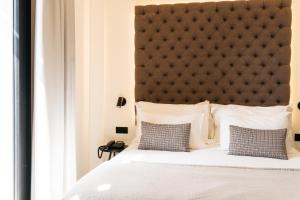 Posteľ alebo postele v izbe v ubytovaní Boutique Hotel Petit Montisión