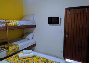 Postel nebo postele na pokoji v ubytování Maresia Hostel Paraty BR