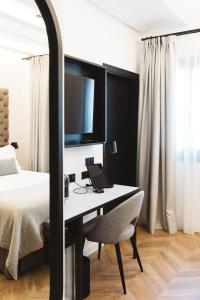 Posteľ alebo postele v izbe v ubytovaní Boutique Hotel Petit Montisión