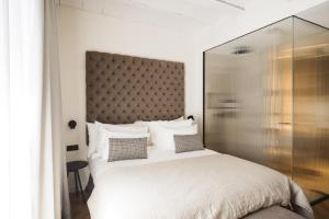 Posteľ alebo postele v izbe v ubytovaní Boutique Hotel Petit Montisión