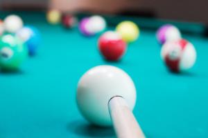 a cue ball on a pool table at Al Diar Dana Hotel in Abu Dhabi