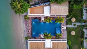 an overhead view of a swimming pool next to a beach at Selina Serenity Rawai Phuket in Rawai Beach