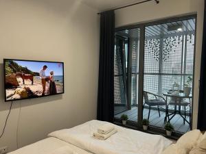 Televízia a/alebo spoločenská miestnosť v ubytovaní Baltic Riviera Apartments - Granaria Riverside