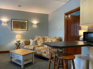 a living room with a couch and a table at Milecastle Inn on Hadrian's Wall near Haltwhistle in Haltwhistle