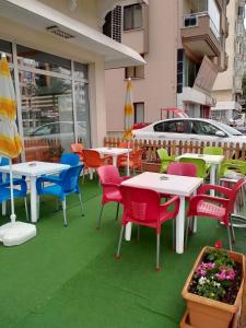 a group of tables and chairs on a patio at Oreko Express in Afyon