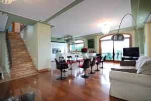 a living room with a table and chairs at Agriturismo La Limonaia in Mondavio