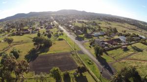 an aerial view of a village with a road and houses at Hermitage Hill Country Retreat in Wellington