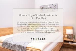 Postel nebo postele na pokoji v ubytování Zeighaus Murtal