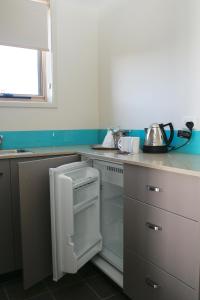 A kitchen or kitchenette at The Dorsal Boutique Hotel