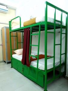 Postel nebo postele na pokoji v ubytování Chez Prabha Homestay