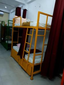 Palanda nebo palandy na pokoji v ubytování Chez Prabha Homestay