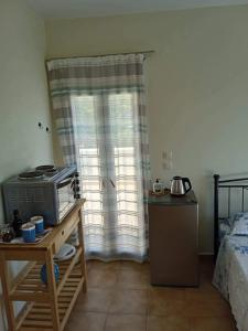 Kuchyň nebo kuchyňský kout v ubytování Leros 'Sundown' Guest house