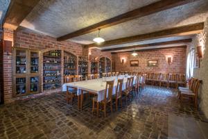 a large dining room with a long table and chairs at Hotel Srakovcic Heart of Nature in Ribnik