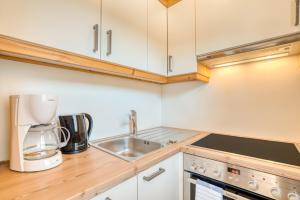 Kuchyň nebo kuchyňský kout v ubytování Appartement Hofmann