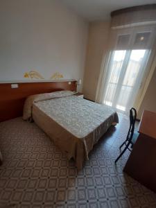 Postel nebo postele na pokoji v ubytování Mio Hotel Firenze