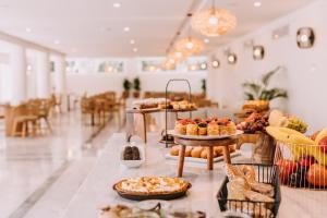 a bakery with a variety of pastries on display at Brown Beach Evia Island, All Inclusive in Eretria, a member of Brown Hotels in Eretria