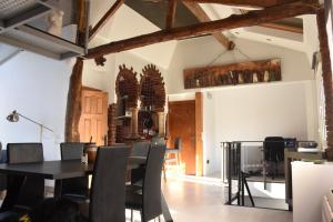 a dining room with a table and chairs at Apartamentos Tierra y Arte in Santoña