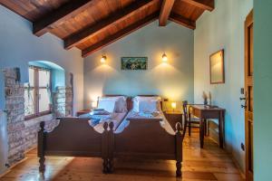 a bedroom with a bed and a table in a room at Villa Murva in Žminj +63 photos