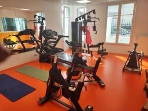 a gym with several treadmills and exercise bikes at Neoresid Paris-Gagny in Gagny
