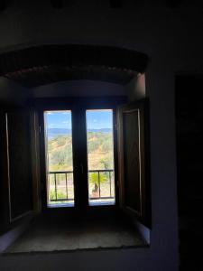 a window in a room with a view at Affittacamere Il Vecchio Mandorlo in Montemagno