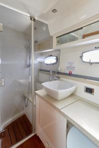 a bathroom with a sink and a shower at Marli II in Lymington