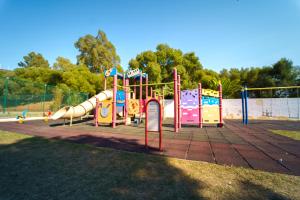 a playground with a slide in a park at Kampaoh Valdevaqueros in Tarifa