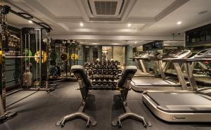 a gym with rows of exercise bikes and treadmills at Meritel Hanoi in Hanoi