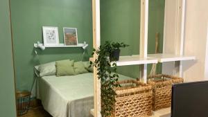 a room with a bed and two shelves with plants at Acqua Dolce in Capodimonte