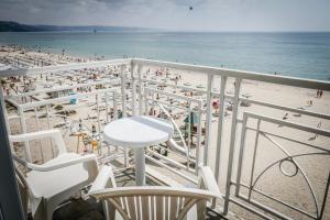 a balcony with a view of a beach at Hotel Gergana - Ultra All Inclusive in Albena