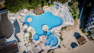 an overhead view of a large blue pool with a theme park at Hotel Gergana - Ultra All Inclusive in Albena