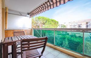 a balcony with a table and an aquarium at Amazing Apartment In Cannes With Wifi in Cannes