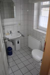 Koupelna v ubytování Ferienwohnung 1066 App 3 in Tossens