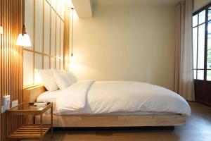 מיטה או מיטות בחדר ב-Villa Panalai