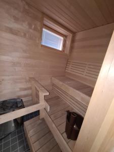 an inside view of a wooden cabin with a stove at MR Apartments 2 in Vaasa