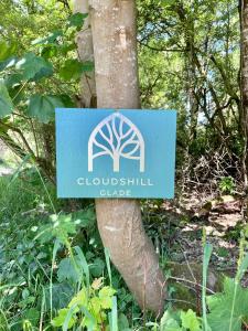 a sign on the side of a tree at Nuthatch Cabin at Cloudshill Glade in Wareham