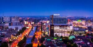 a view of a city at night with buildings at Hotel Horison Ultima Bekasi in Bekasi