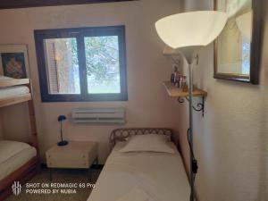 Posteľ alebo postele v izbe v ubytovaní A casa di Sognu