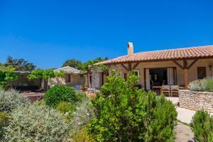 a house with a garden in front of it at Villa SoleLuna in Bonifacio