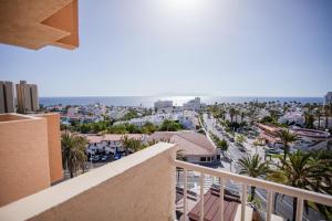 a view of a city from the balcony of a building at Servatur Caribe in Playa de las Americas