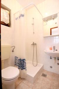 a bathroom with a toilet and a sink at Apartments by the sea Sveta Nedilja, Hvar - 110 in Sveta Nedelja