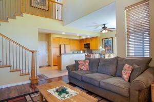 a living room with a couch and a table at Waikoloa Colony Villas 2706 in Waikoloa