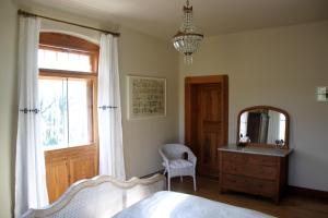 a bedroom with a bed and a mirror and a dresser at Villa Sunnyside 1 in Dresden